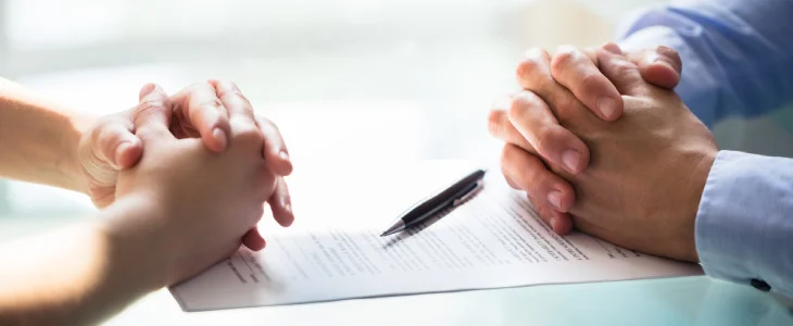 Employer and employee reviewing the severance agreement